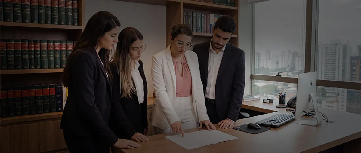 The firm's team reviewing a case file together