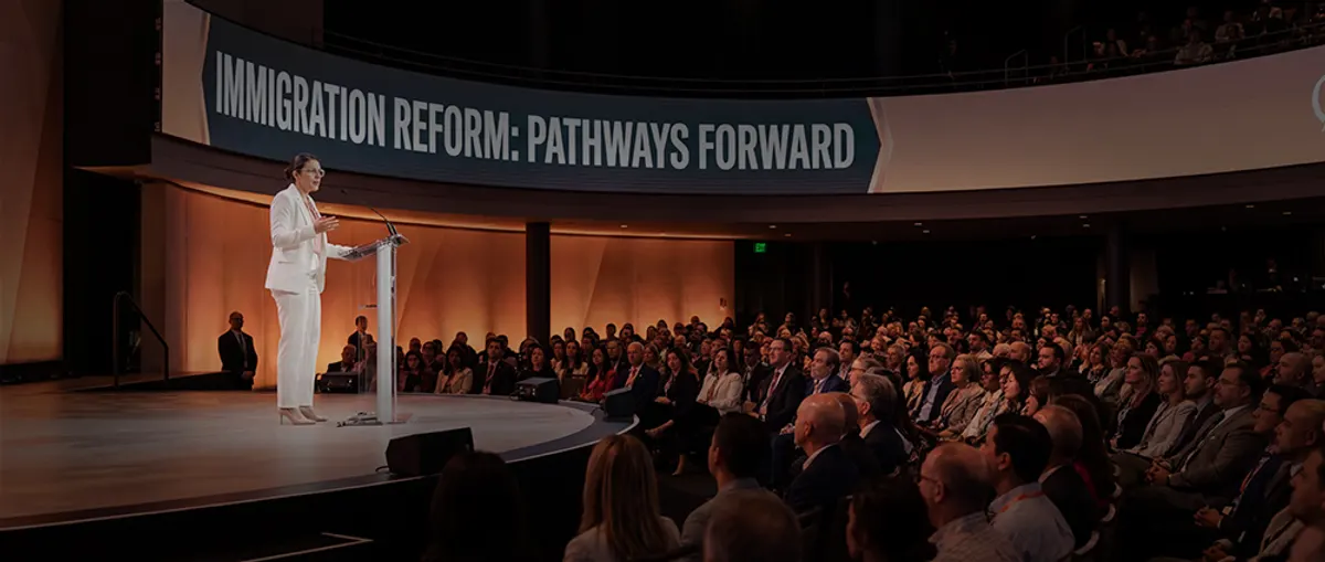 Sweta Patel speaking at an immigration reform conference